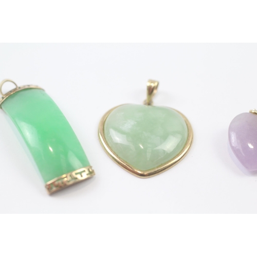 250 - 3 x 9ct gold green jade, purple jade and diamond, and dyed green jade pendants (9.7g)