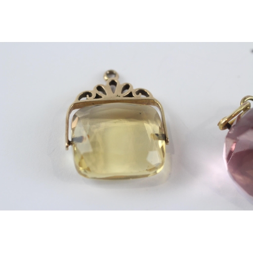 252 - 2 x 9ct gold citrine and pink glass spinner fobs (12.6g)