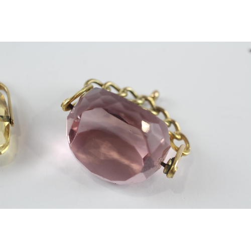 252 - 2 x 9ct gold citrine and pink glass spinner fobs (12.6g)