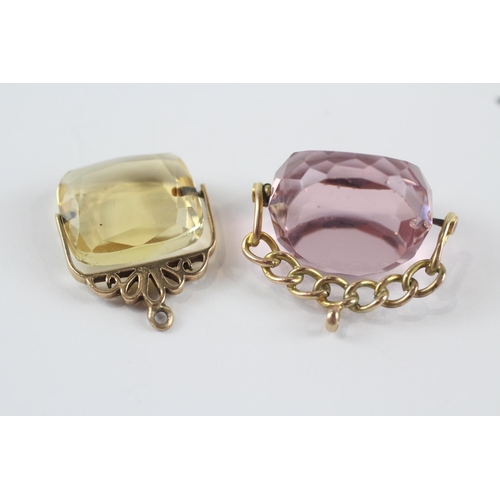 252 - 2 x 9ct gold citrine and pink glass spinner fobs (12.6g)