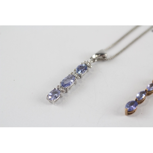 273 - 2 x 9ct white & yellow gold tanzanite bar pendant necklaces (2.8g)