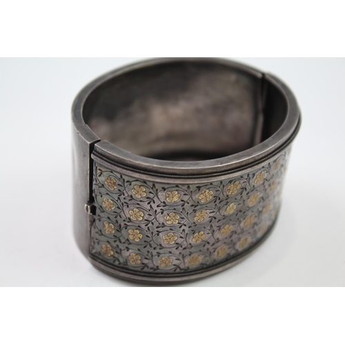 278 - Silver antique wide hinged bangle with gold detailing (45g)