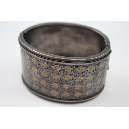 278 - Silver antique wide hinged bangle with gold detailing (45g)