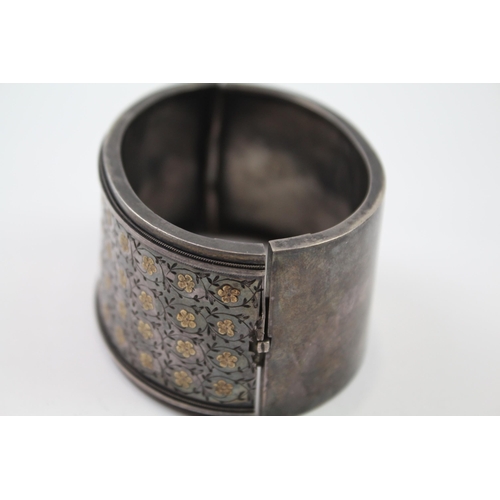 278 - Silver antique wide hinged bangle with gold detailing (45g)