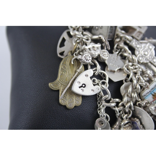 295 - Silver charm bracelet with heart padlock clasp (105g)