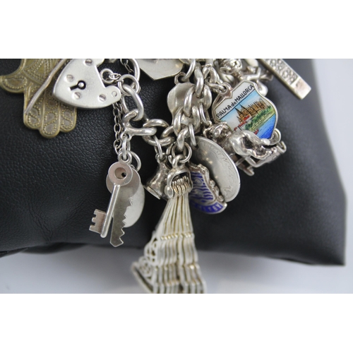 295 - Silver charm bracelet with heart padlock clasp (105g)