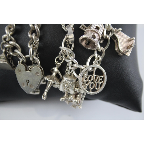 296 - Two silver charm bracelets with heart padlock clasps (85g)