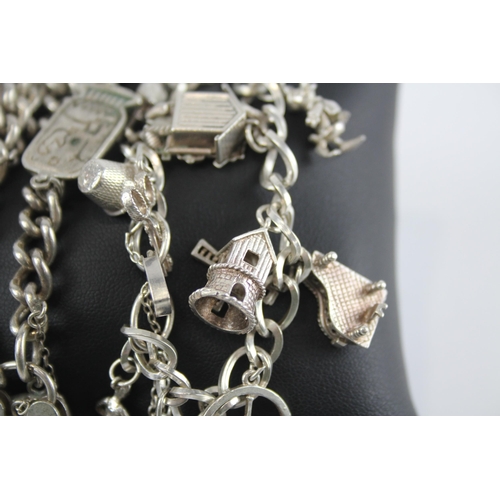 296 - Two silver charm bracelets with heart padlock clasps (85g)