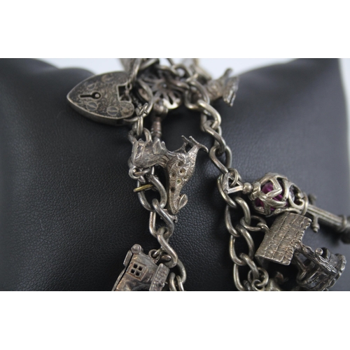 298 - Silver charm bracelet with heart padlock clasp (75g)