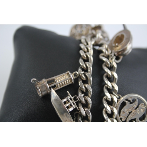 299 - Silver charm bracelet with heart padlock clasp (61g)