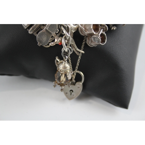 305 - Silver charm bracelet with heart padlock clasp (108g)