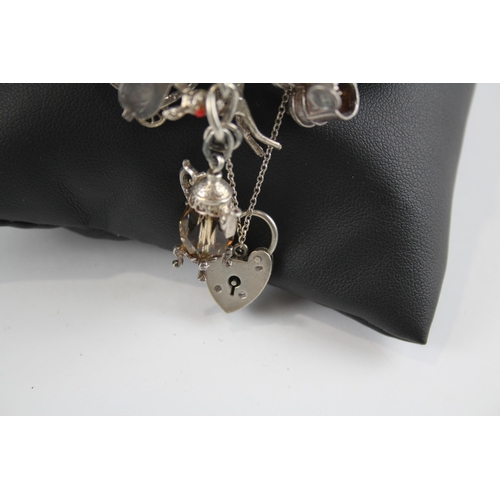 305 - Silver charm bracelet with heart padlock clasp (108g)