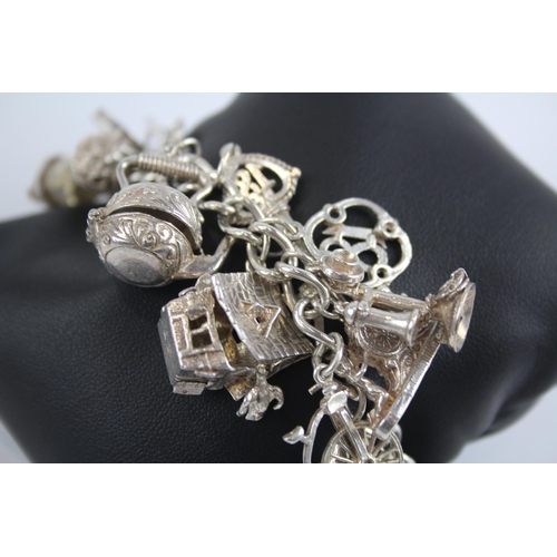 311 - Silver charm bracelet with heart padlock clasp (88g)