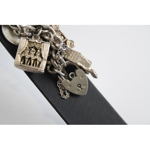 331 - Silver charm bracelet with heart padlock clasp (60g)