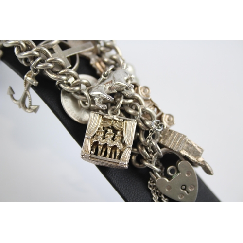 331 - Silver charm bracelet with heart padlock clasp (60g)