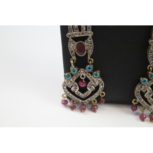 335 - A pair of silver traditional wedding earrings including gemstone (16g)