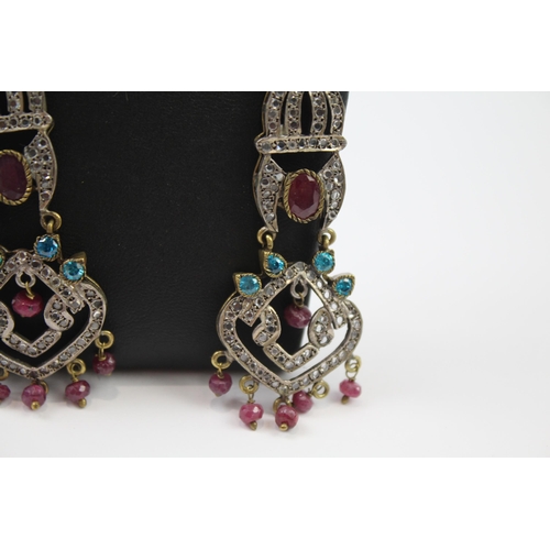 335 - A pair of silver traditional wedding earrings including gemstone (16g)