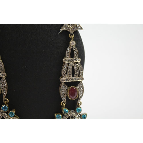 335 - A pair of silver traditional wedding earrings including gemstone (16g)