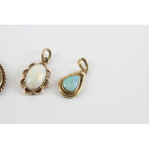 87 - 3 X 9ct Gold White Opal Pendants (4.4g)