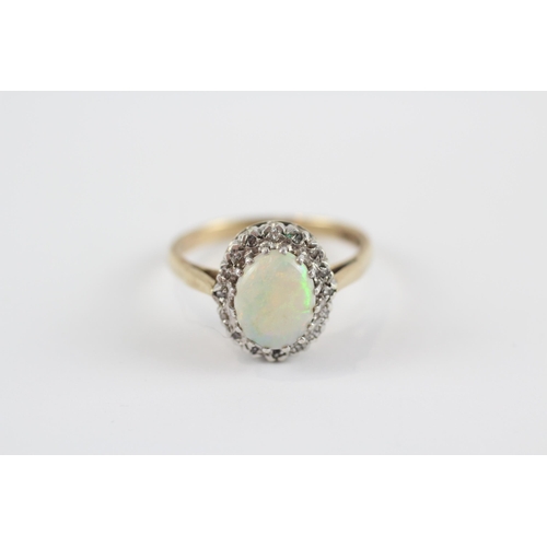 98 - 9ct Gold Diamond & White Opal Oval Halo Ring (3.3g) Size  O 1/2