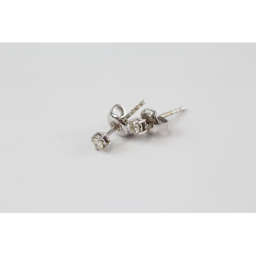 176 - 18ct white gold diamond paired stud earrings (1.1g)