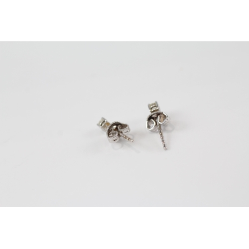 176 - 18ct white gold diamond paired stud earrings (1.1g)