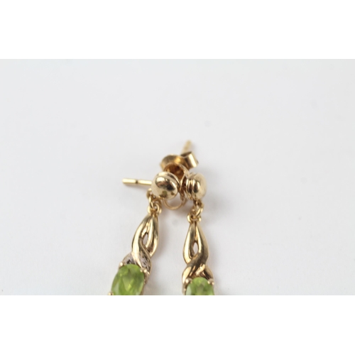 53 - 9ct gold peridot drop paired earrings (1.8g)