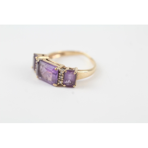 82 - 9ct gold amethyst & diamond trilogy ring (2.8g) Size  M