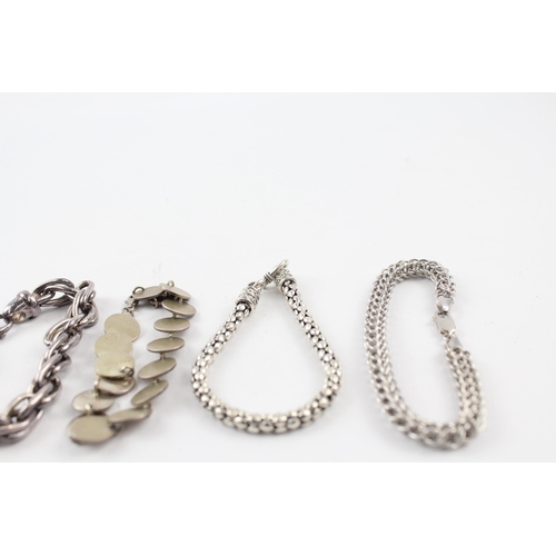 201 - Four silver bracelets including popcorn link (81g)