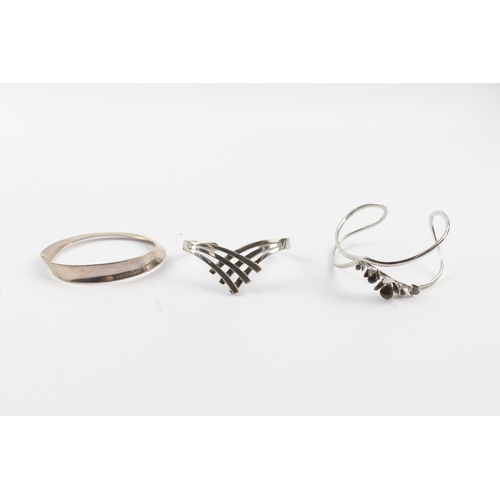 202 - Three silver modernist bangles (65g)