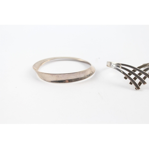 202 - Three silver modernist bangles (65g)