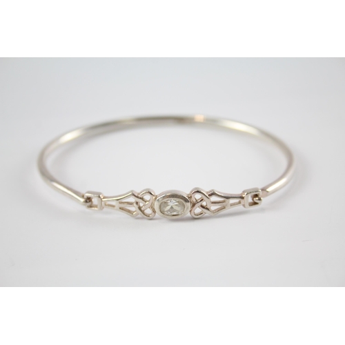 203 - Four silver CZ bangles including Celtic (41g)