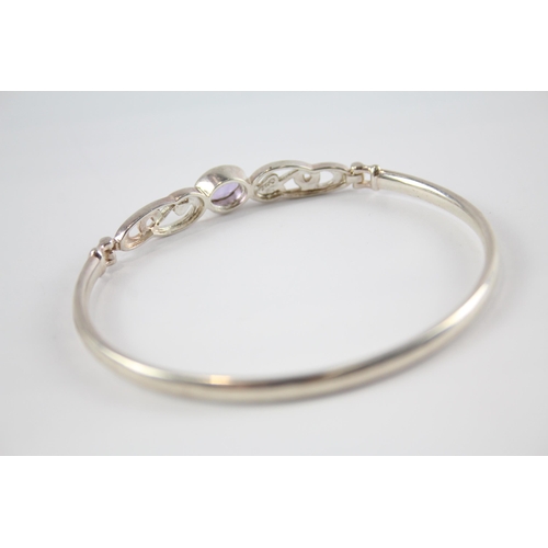 203 - Four silver CZ bangles including Celtic (41g)