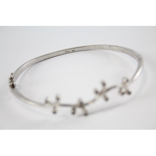 203 - Four silver CZ bangles including Celtic (41g)