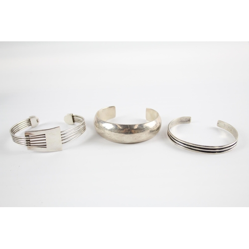 204 - Three silver modernist bangles (75g)