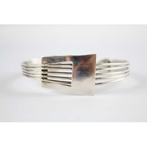 204 - Three silver modernist bangles (75g)