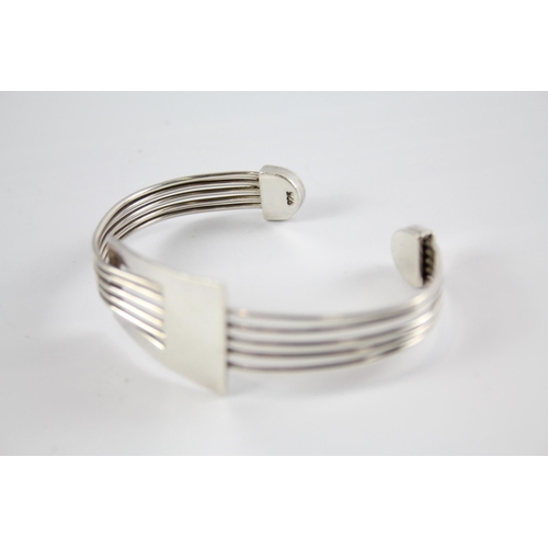 204 - Three silver modernist bangles (75g)