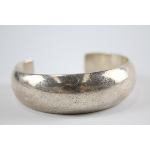 204 - Three silver modernist bangles (75g)