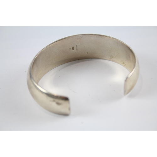 204 - Three silver modernist bangles (75g)