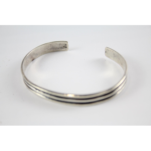 204 - Three silver modernist bangles (75g)