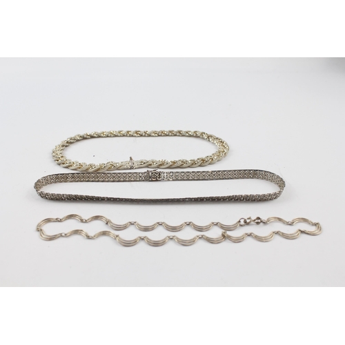 205 - Three silver necklaces including plaited (66g)