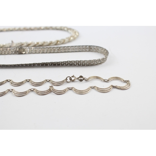 205 - Three silver necklaces including plaited (66g)