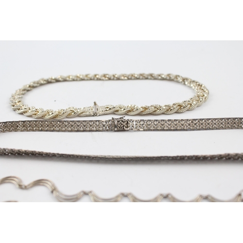 205 - Three silver necklaces including plaited (66g)