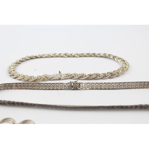 205 - Three silver necklaces including plaited (66g)