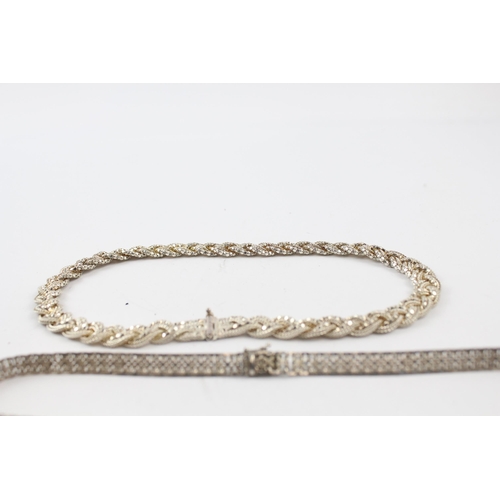 205 - Three silver necklaces including plaited (66g)