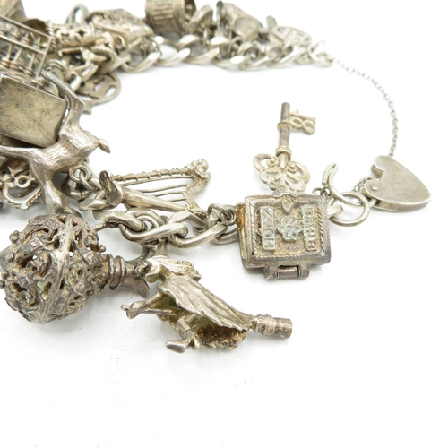 206 - Silver charm bracelet including emergency money charm (95g)