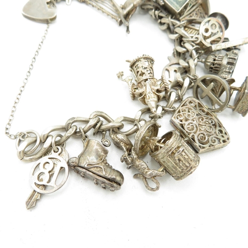 206 - Silver charm bracelet including emergency money charm (95g)