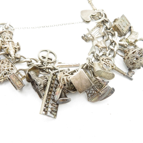 206 - Silver charm bracelet including emergency money charm (95g)