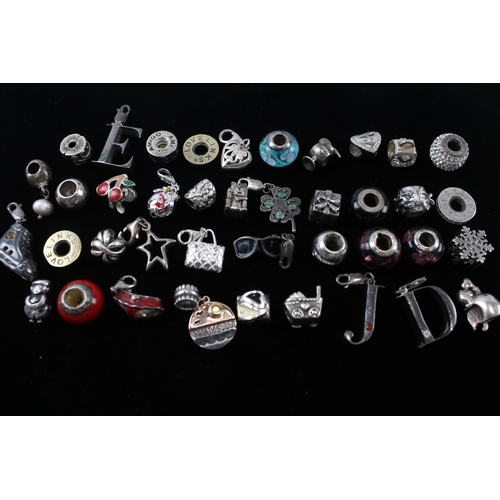 207 - A collection of silver mixed brand charms (112g)