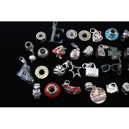 207 - A collection of silver mixed brand charms (112g)